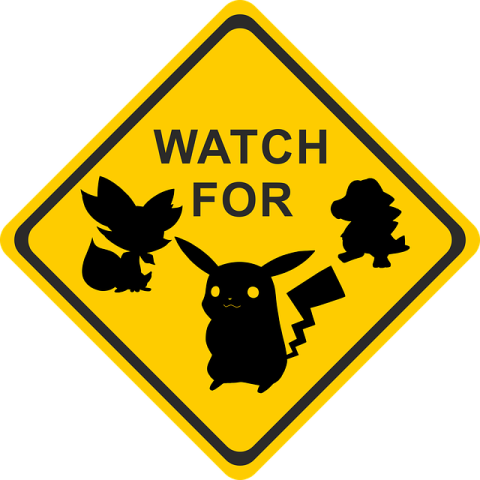 A diamond shaped yellow road sign except it says "Watch for" and shows the silhouettes of three Pokemon below it.
