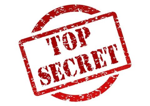 The words "Top Secret" is stamped out on top of a red circle