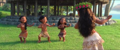 Image from the first Moana movie with Moana teaching moves to three island children.