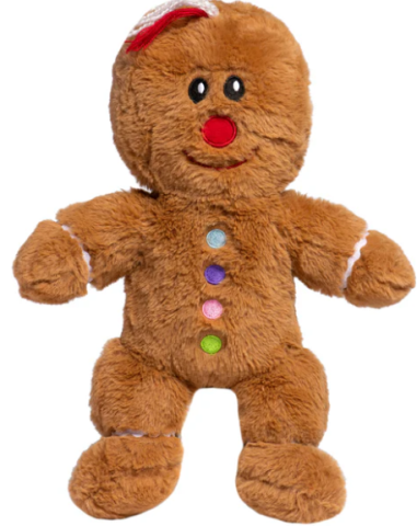 A photo of a gingerbread figure plushie with an embroidered red nose and designs that mark the buttons and trim