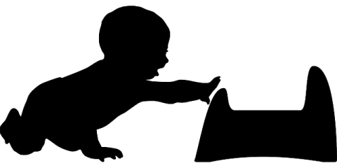 A silhouette of a young child, a baby or a toddler, crawling towards a training potty with one arm outstretched towards it.