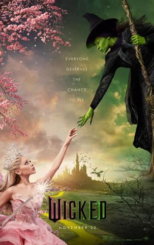 Cynthia Erivo, dressed as Elphaba, rides a broom while reaching down to Ariana Grande, dressed as Galinda, who stretches one arm up to her. Behind them is a dreamlike swirling pastel background and hazily in the distance the spires of the Emerald City