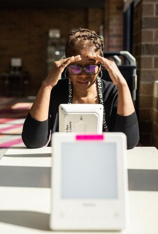 Older patron looking at a computer