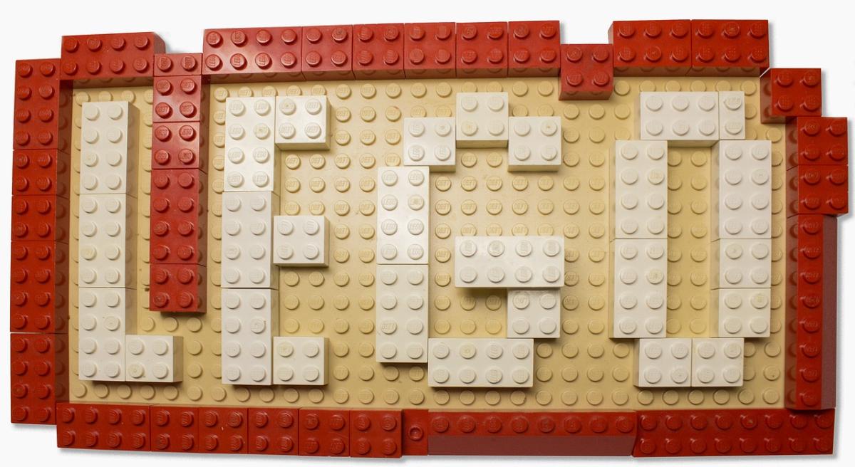 A photo of the word LEGO spelled out in LEGO block letters and outlined with a red LEGO border